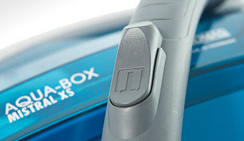 Flap on the hose for suction power adjustment Grey hose handle with a flap for mechanical suction power adjustment